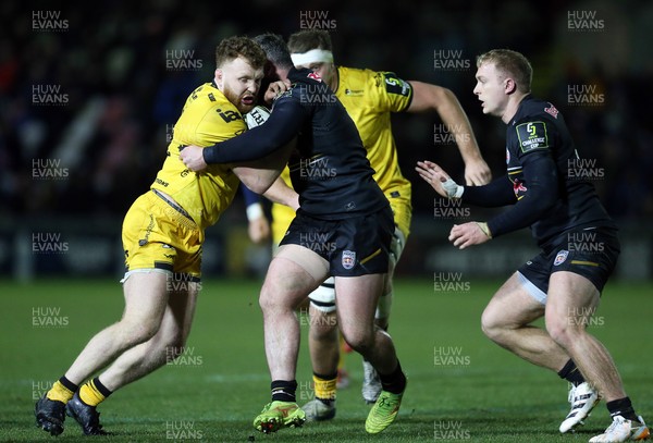 160126 - Dragons v Newcastle Red Bulls - European Rugby Challenge Cup - Thomas Young of Dragons is tackled by Ethan Grayson of Newcastle 