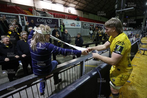 160126 - Dragons v Newcastle Red Bulls - European Rugby Challenge Cup - Aaron Wainwright of Dragons with his group of super fans at full time