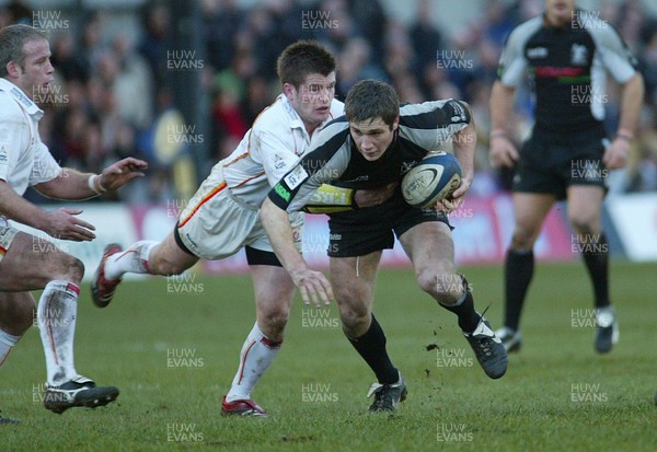 010106Newport Gwent Dragons v Ospreys Ospreys Andrew Bishop holds of Ceri Sweeney  