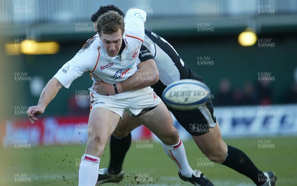 010106Newport Gwent Dragons v Ospreys Dragons Gareth Chapman is tackled by Sonny Parker  