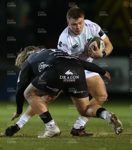 090121 - Dragons v Ospreys - Guinness PRO14 - Ifan Phillips of Ospreys is tackled by Richard Hibbard of Dragons