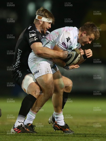 090121 - Dragons v Ospreys - Guinness PRO14 - Ifan Phillips of Ospreys is tackled by Aaron Wainwright of Dragons