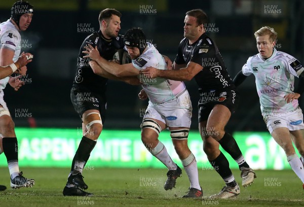 090121 - Dragons v Ospreys - Guinness PRO14 - Morgan Morris of Ospreys is tackled by Josh Lewis and Jamie Roberts of Dragons