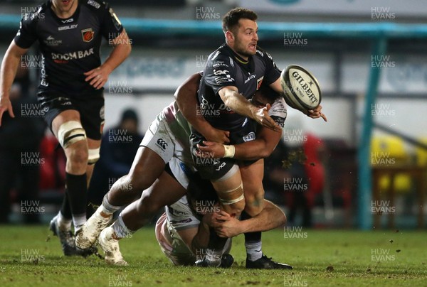 090121 - Dragons v Ospreys - Guinness PRO14 - Josh Lewis of Dragons is tackled by Ma'afu Fia and Rhys Davies of Ospreys