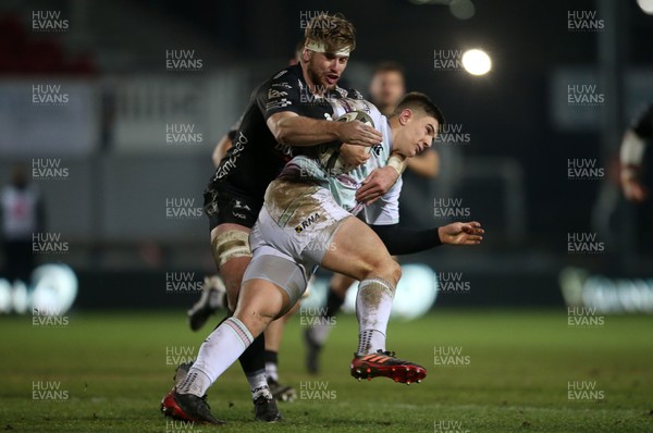 090121 - Dragons v Ospreys - Guinness PRO14 - Joe Hawkins of Ospreys is tackled by Aaron Wainwright of Dragons