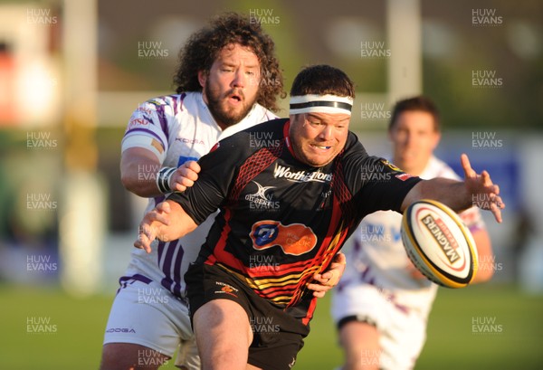 15.04.11 - Newport-Gwent Dragons v Ospreys - Magners League - Ben Castle of Newport-Gwent Dragons is tackled by Adam Jones of Ospreys. 