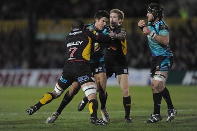 27.03.10 - Newport-Gwent Dragons v Ospreys - Magners League - James Hook of Ospreys is tackled by Gavin Thomas of Newport-Gwent Dragons. 