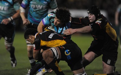 27.03.10 - Newport-Gwent Dragons v Ospreys - Magners League - Mike Phillips of Ospreys is tackled by Toby Faletau of Newport-Gwent Dragons. 