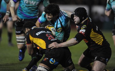 27.03.10 - Newport-Gwent Dragons v Ospreys - Magners League - Mike Phillips of Ospreys is tackled by Toby Faletau of Newport-Gwent Dragons. 