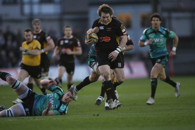 27.03.10 Dragons v Ospreys... Dragons' Hugh Gustafson slips the tackle from Ian Evans 