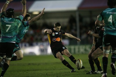 27.03.10 Dragons v Ospreys... Dragons' Jason Tovey attempts a drop goal. 