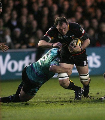 27.03.10 Dragons v Ospreys... Dragons' Robert Sidoli is tackled by Ospreys' Huw Bennett. 