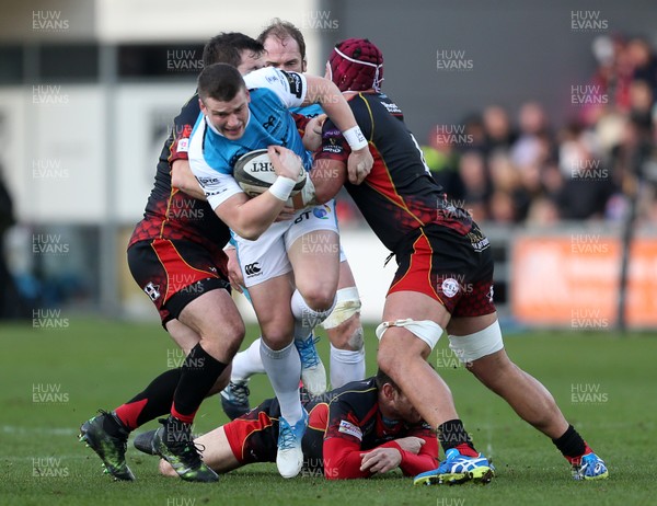 301218 - Dragons v Ospreys - Guinness PRO14 - Scott Williams of Ospreys is tackled by Aaron Jarvis and Brandon Nansen of Dragons
