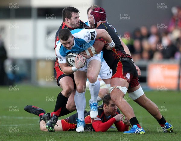 301218 - Dragons v Ospreys - Guinness PRO14 - Scott Williams of Ospreys is tackled by Aaron Jarvis and Brandon Nansen of Dragons