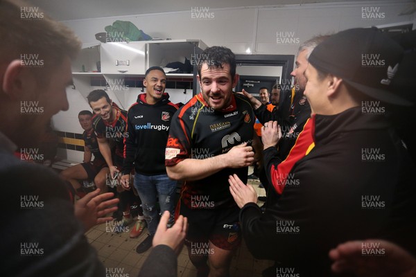 301218 - Dragons v Ospreys - Guinness PRO14 - Aaron Jarvis of Dragons is pulled into the changing room by team mates