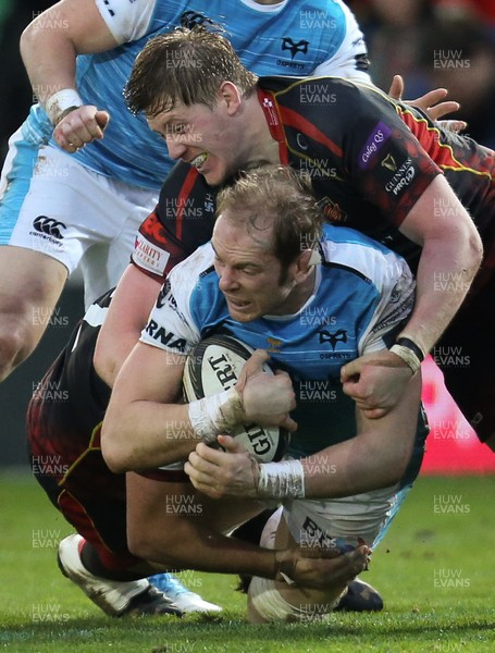 301218 - Dragons v Ospreys, Guinness PRO14 - Alun Wyn Jones of Ospreys is tackled by Jarryd Sage of Dragons and Matthew Screech of Dragons