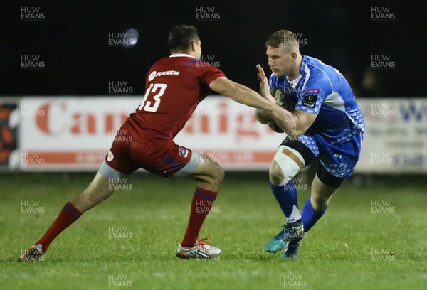161118 - Dragons v Russia Rugby, International Friendly - Jack Dixon of Dragons holds off Mikhail Babaev of Russia