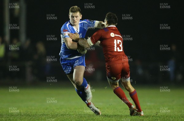 161118 - Dragons v Russia Rugby, International Friendly - Dafydd Howells of Dragons holds off Mikhail Babaev of Russia