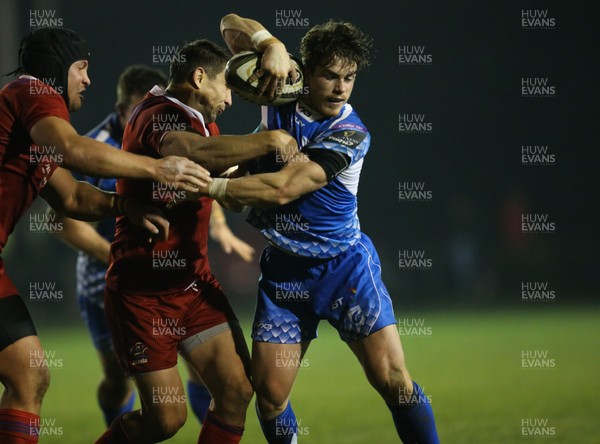 161118 - Dragons v Russia Rugby, International Friendly - Rhodri Davies of Dragons is held by Mikhail Babaev of Russia