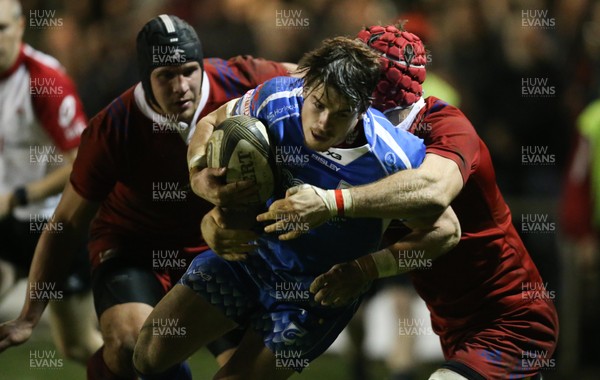 161118 - Dragons v Russia Rugby, International Friendly - Rhodri Davies of Dragons is tackled by Vitaly Zhivatov of Russia