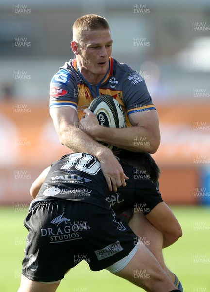 140919 - Dragons v Scarlets - Pre Season Friendly - Johnny McNicholl of Scarlets is tackled by Sam Davies of Dragons