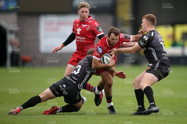 161020 - Dragons v Scarlets - Friendly - Paul Asquith of Scarlets is tackled by Joe Thomas and Aneurin Owen of Dragons