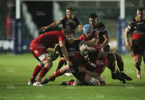 171117 - Dragons v Scarlets, Anglo-Welsh Cup - Matthew Screech of Dragons is hauls down by the Scarlets defence