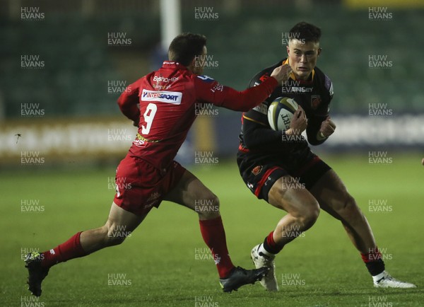 171117 - Dragons v Scarlets, Anglo-Welsh Cup - Jared Rosser of Dragons takes on Lee Rees of Scarlets and Morgan Griffiths of Scarlets