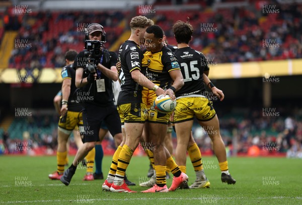 190425 - Dragons v Scarlets - Judgement Day X - United Rugby Championship - Ashton Hewitt of Dragons celebrates scoring a try with team mates