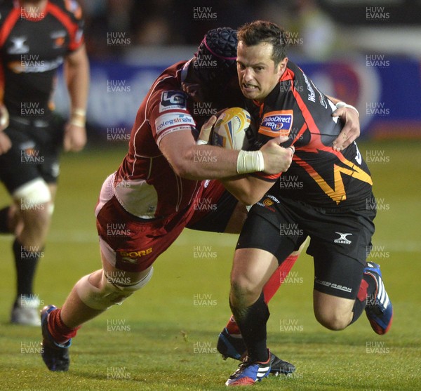 200913 - Dragons v Scarlets - RaboDirect PRO12Dan Evans of Dragons, right, is tackled by George Earle of Scarlets (c) Huw Evans Picture Agency