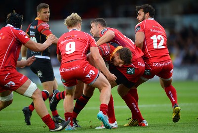 210815 - Newport-Gwent Dragons v Scarlets - Preseason Friendly -Ross Wardle of Dragons is tackled by Aled Davies and Steven Shingler of Scarlets