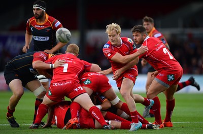 210815 - Newport-Gwent Dragons v Scarlets - Preseason Friendly -Aled Davies of Scarlets gets the ball away