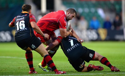 210815 - Newport-Gwent Dragons v Scarlets - Preseason Friendly -Morgan Allen of Scarlets is tackled by Phil Price of Dragons