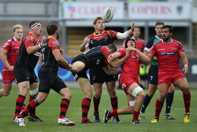 210815 - Newport Gwent Dragons v Scarlets, Pre-Season Friendly match - Dragons Thomas Rhys Thomas looks to claim the loose ball