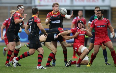 210815 - Newport Gwent Dragons v Scarlets, Pre-Season Friendly match - Dragons Thomas Rhys Thomas looks to claim the loose ball