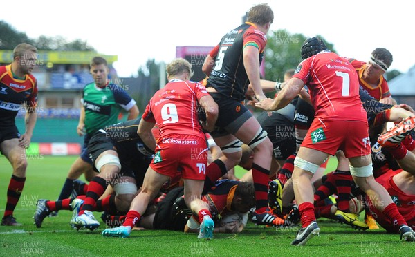 210815 - Newport-Gwent Dragons v Scarlets - Preseason Friendly -T Rhys Thomas (ground) of Dragons scores try