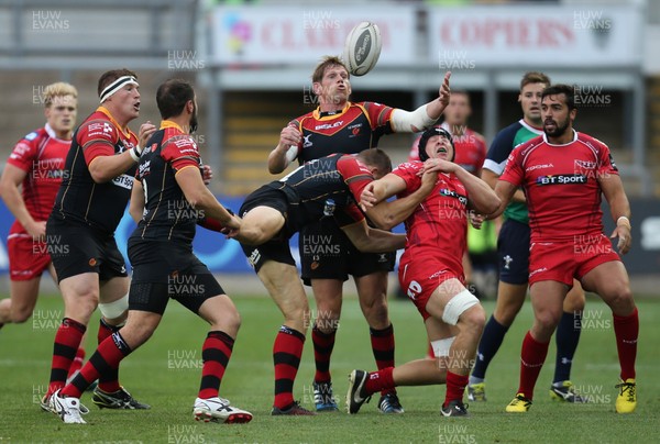 210815 - Newport Gwent Dragons v Scarlets, Pre-Season Friendly match - Dragons Thomas Rhys Thomas looks to claim the loose ball