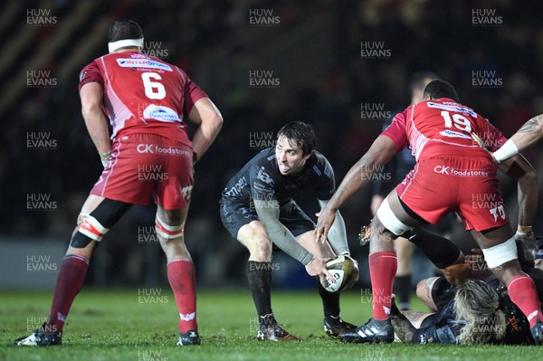 211219 - Dragons v Scarlets - Guinness PRO14 - Rhodri Williams of Dragons gets the ball away