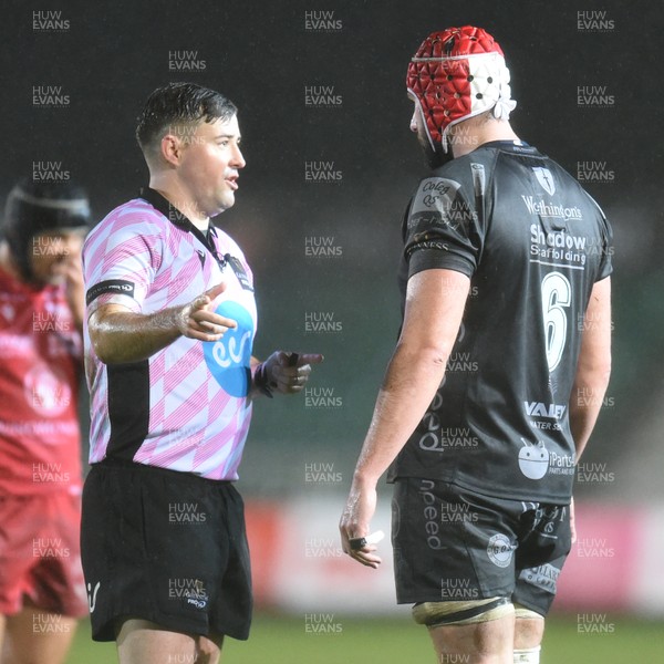 211219 - Dragons v Scarlets - Guinness Pro 14 - Referee Ben Whitehouse talks to Cory Hill of Dragons