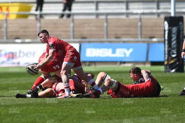250421 Dragons v Scarlets, Guinness PRO14 Rainbow Cup - Dane Blacker of Scarlets passes the ball out 