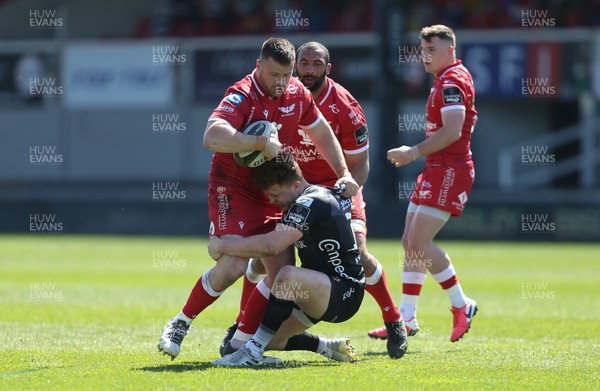 250421 Dragons v Scarlets, Guinness PRO14 Rainbow Cup - Rob Evans of Scarlets takes on Aneurin Owen of Dragons