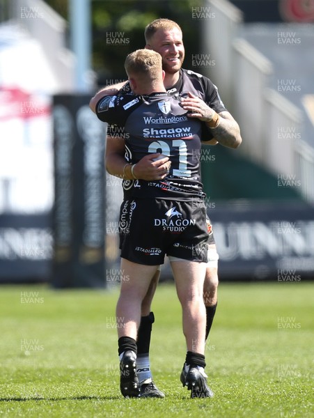 250421 Dragons v Scarlets, Guinness PRO14 Rainbow Cup - Ross Moriarty of Dragons and Dan Babos of Dragons celebrate at the end of the match