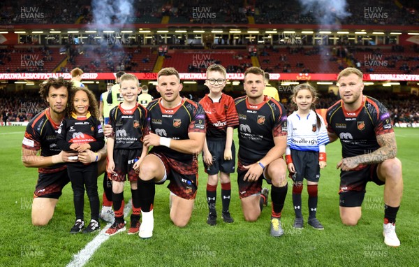 270419 - Dragons v Scarlets - Guinness PRO14 - Judgement Day - Zane Kirchner of Dragons, Elliot Dee, Josh Lewis and Ross Moriarty of Dragons with mascots