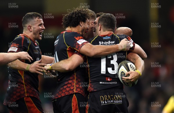 270419 - Dragons v Scarlets - Guinness PRO14 - Judgement Day - Josh Lewis of Dragons celebrates try with team mates
