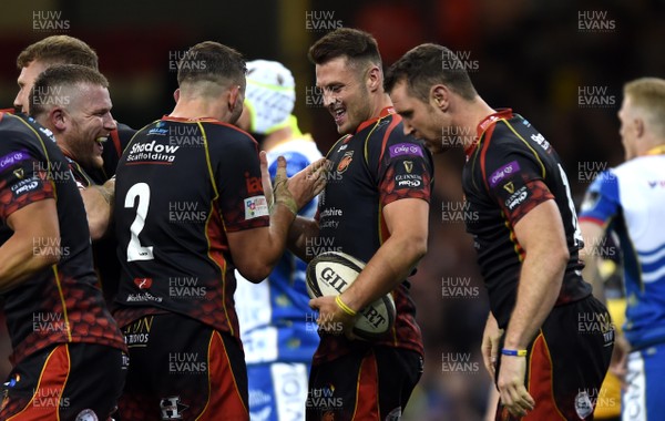 270419 - Dragons v Scarlets - Guinness PRO14 - Judgement Day - Josh Lewis of Dragons celebrates try with team mates