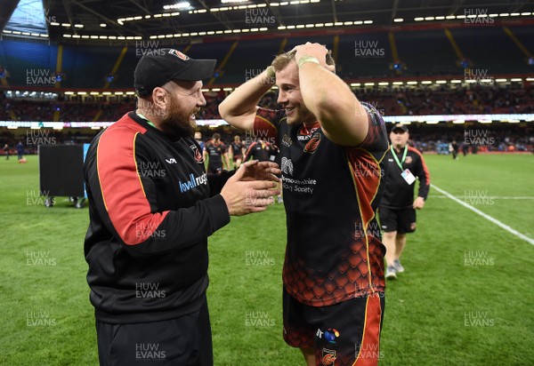 270419 - Dragons v Scarlets - Guinness PRO14 - Judgement Day - Dragons head coach Ceri Jones and Elliot Dee of Dragons celebrate at the end of the game