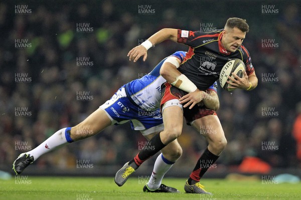 270419 - Dragons v Scarlets, Judgement Day VII, Guinness PRO14 - Josh Lewis of Dragons is tackled by Hadleigh Parkes of Scarlets