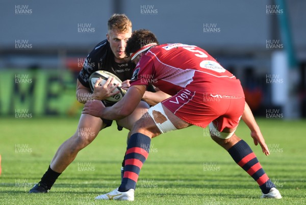 290820 - Dragons v Scarlets - Guinness PRO14 - Jack Dixon of Dragons is tackled by Lewis Rawlins of Scarlets