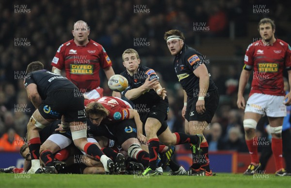 300313 - Newport-Gwent Dragons v Scarlets - RaboDirect PRO12 - Jonathan Evans of Newport-Gwent Dragons gets the ball away 