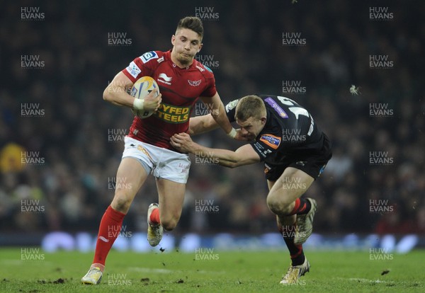 300313 - Newport-Gwent Dragons v Scarlets - RaboDirect PRO12 - Owen Williams of Scarlets is tackled by Jack Dixon of Newport-Gwent Dragons 